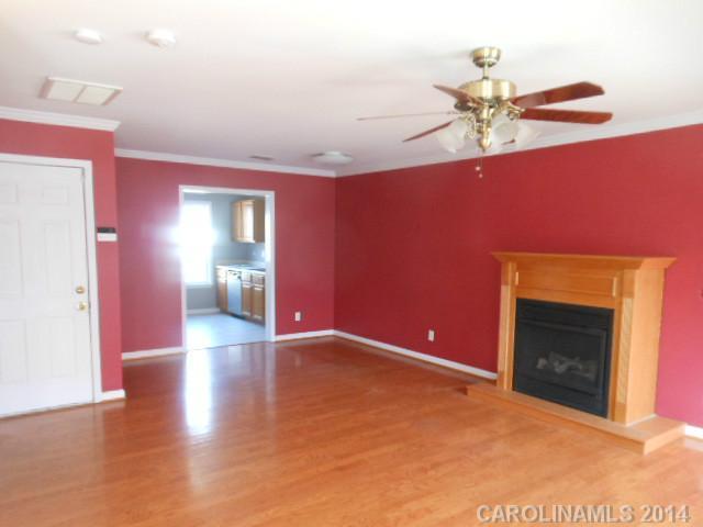 17311 Villanova Road, Unit 84 Huntersville, NC 28078 - Photo 2 of 14 a view of an empty room with a fireplace