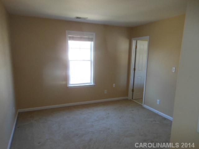 17311 Villanova Road, Unit 84 Huntersville, NC 28078 - Photo 11 of 14 an empty room with a window