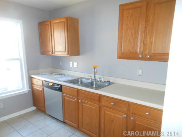 17311 Villanova Road, Unit 84 Huntersville, NC 28078 - Photo 4 of 14 a bathroom with a sink and a mirror