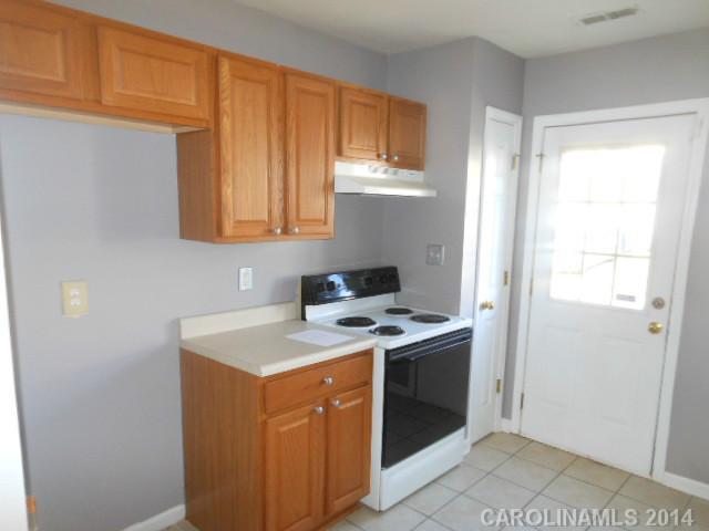 17311 Villanova Road, Unit 84 Huntersville, NC 28078 - Photo 5 of 14 a kitchen with a stove and a sink