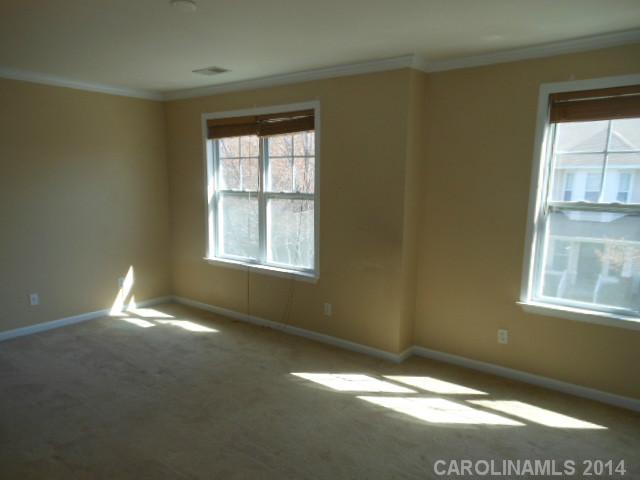 17311 Villanova Road, Unit 84 Huntersville, NC 28078 - Photo 8 of 14 a view of an empty room with a window