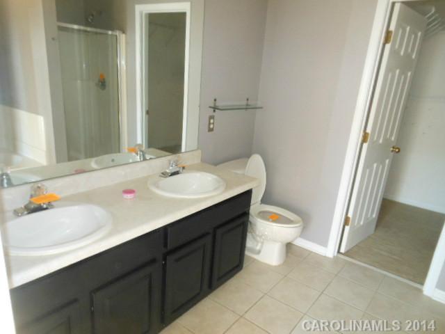 17311 Villanova Road, Unit 84 Huntersville, NC 28078 - Photo 9 of 14 a bathroom with a sink toilet and shower