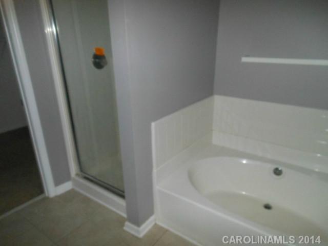 17311 Villanova Road, Unit 84 Huntersville, NC 28078 - Photo 10 of 14 a bathroom with a bathtub