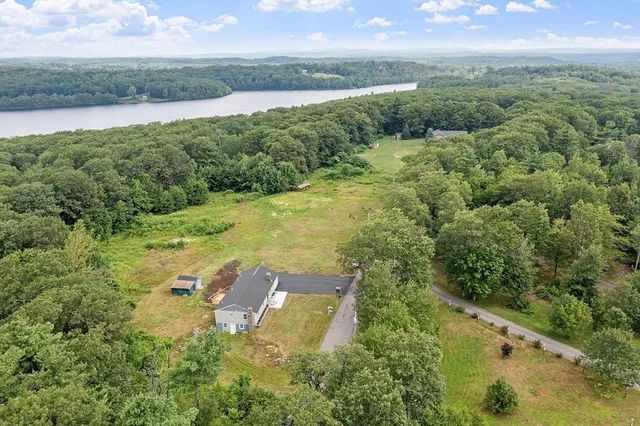 a view of lake with green space