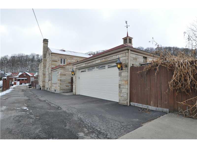 1103 13th Street McKees Rocks, PA 15136 - Photo 21 of 25 Exterior Back. The garage can comfortably hold 2 SUVs and still have plenty of room for a work bench and other storage.