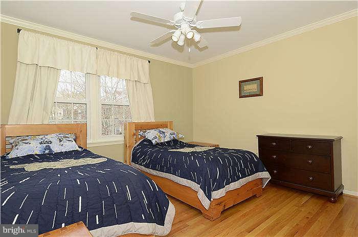 8003 Rising Ridge Road Bethesda, MD 20817 - Photo 14 of 19 a bedroom with two beds and a dresser