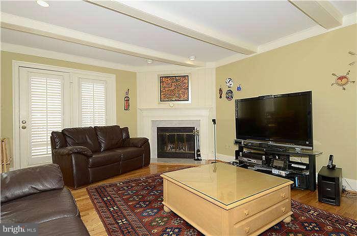 8003 Rising Ridge Road Bethesda, MD 20817 - Photo 3 of 19 a living room with furniture and a flat screen tv