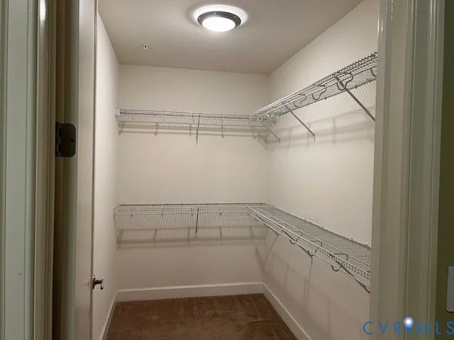 a view of an empty walk in closet