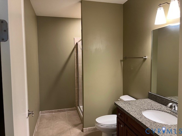 301 Virginia Street, Unit 1102 Richmond, VA 23219 - Photo 15 of 28 a bathroom with a granite countertop toilet sink and mirror