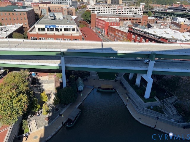 301 Virginia Street, Unit 1102 Richmond, VA 23219 - Photo 16 of 28 a roof deck with table and chairs
