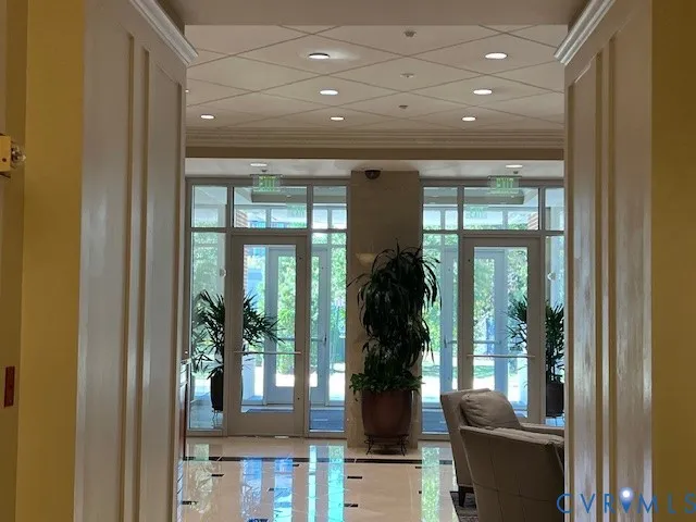 a room with furniture and a potted plant