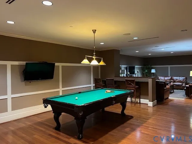 a room with furniture and pool table