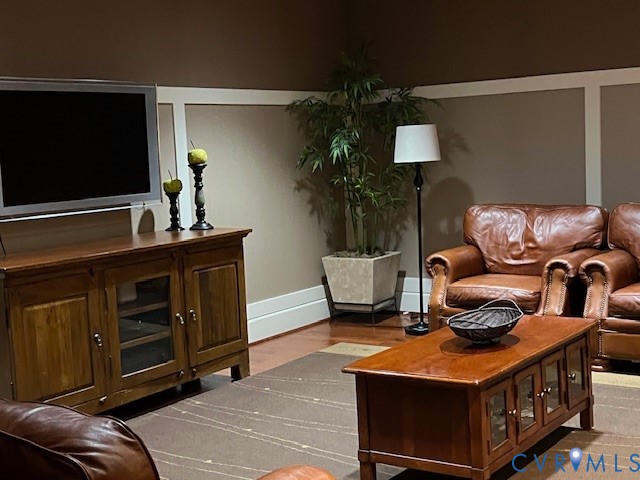 301 Virginia Street, Unit 1102 Richmond, VA 23219 - Photo 27 of 28 a living room with furniture and a flat screen tv