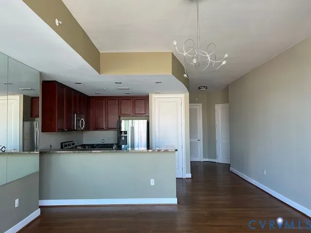 a view of a kitchen with a dishwasher and cabinets