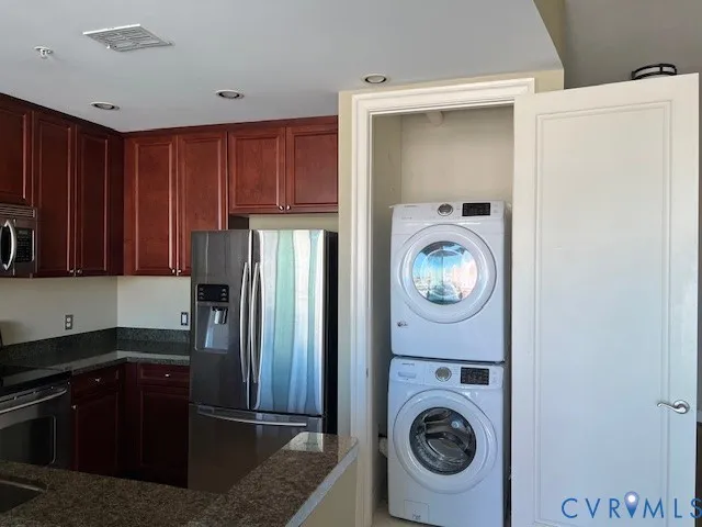a kitchen with a refrigerator and a sink