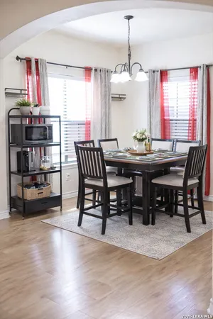 a view of a dining room with furniture and window