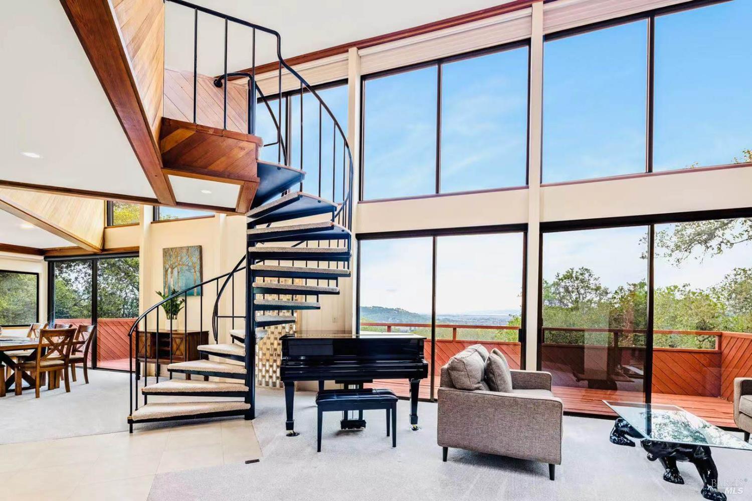 Floor-to-ceiling windows frame sweeping vistas, bringing the beauty of the outdoors into every corner of the home.