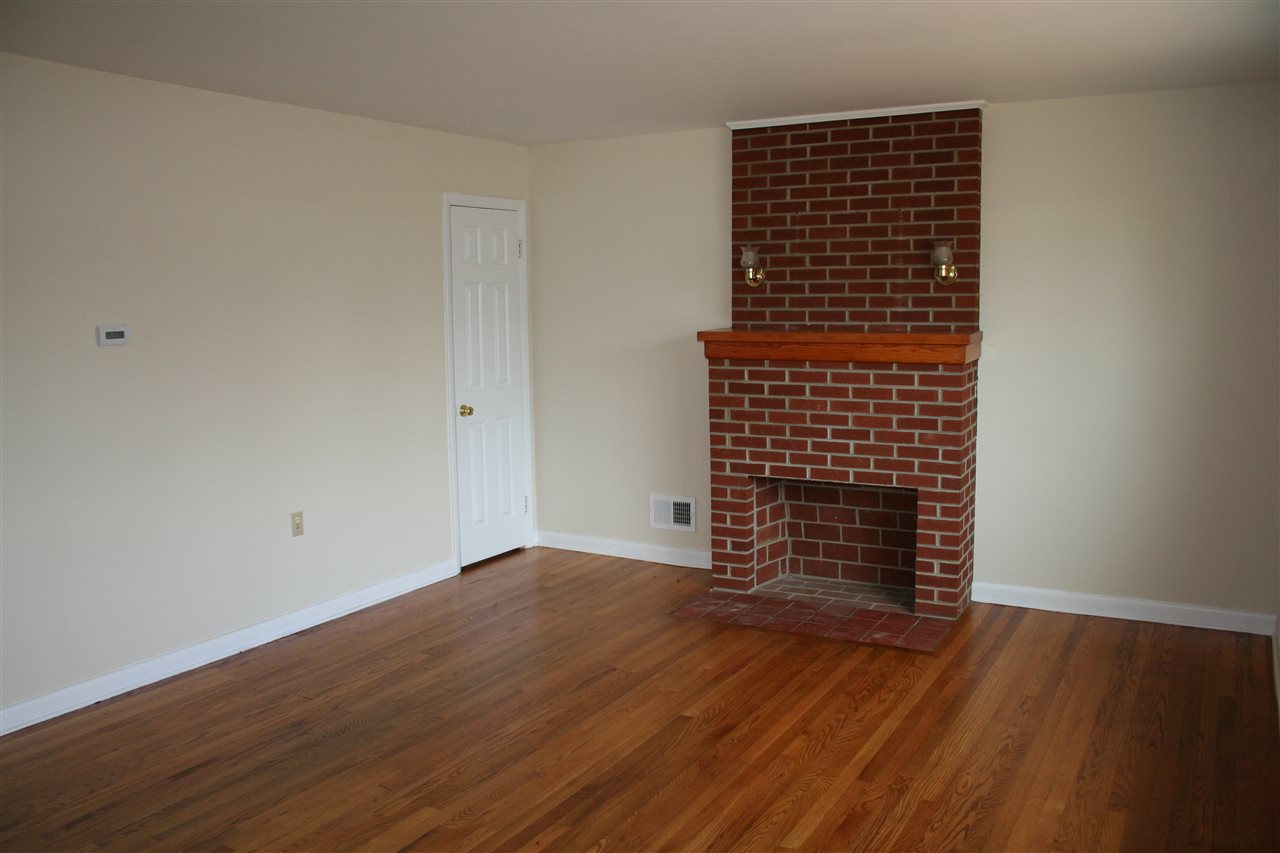 209 Oak Park Road Madison, VA 22727 - Photo 8 of 20 wooden floor in an empty room