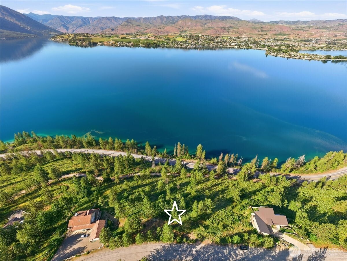 7376 Ridgeview Drive Chelan, WA 98816 - Photo 16 of 21 a view of a lake with a mountain