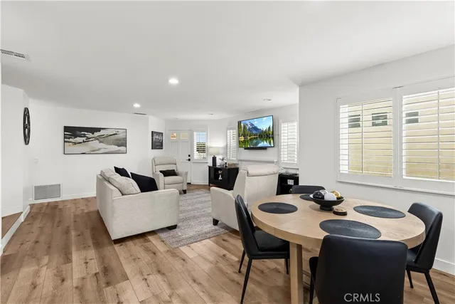 a living room with fireplace furniture and a flat screen tv