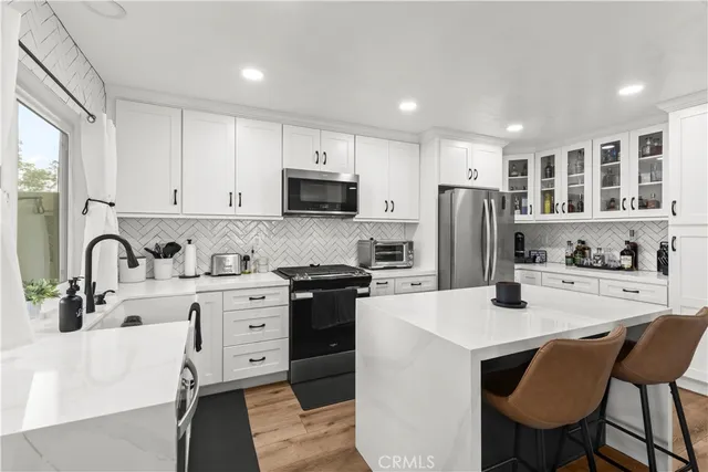 a view of a livingroom with furniture and a front door