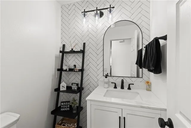 a kitchen with stainless steel appliances a stove sink and refrigerator