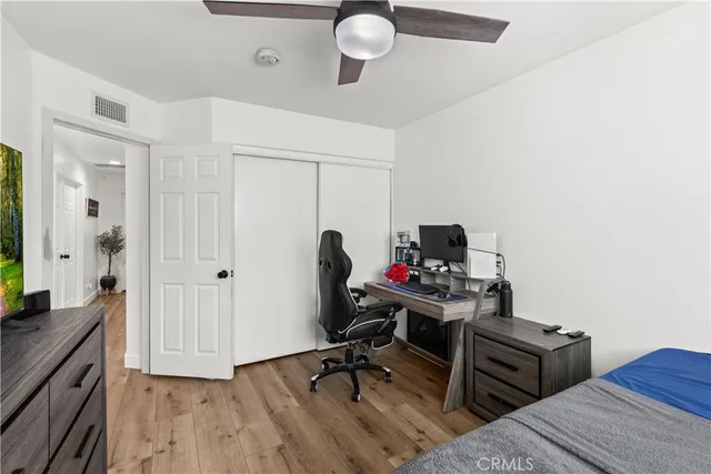 a bedroom with a workspace