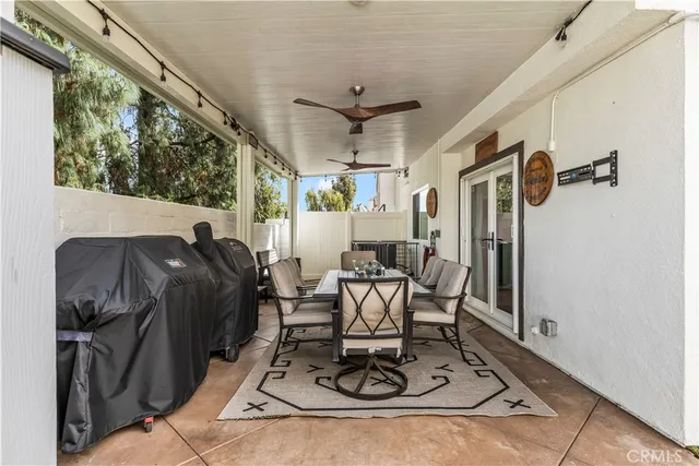 a view of a table and chairs in a patio