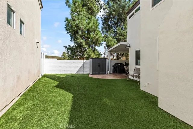 a view of a back yard of the house
