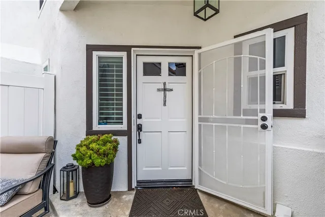 a room with furniture and a potted plant