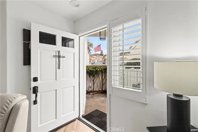 a view of a livingroom with wooden floor and a window