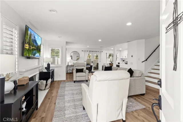 a living room with furniture and flat screen tv