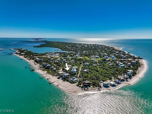an aerial view of a houses with a lake view