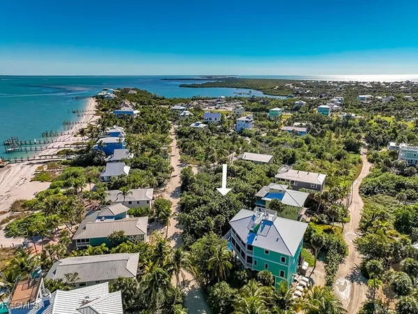 an aerial view of a city with ocean view
