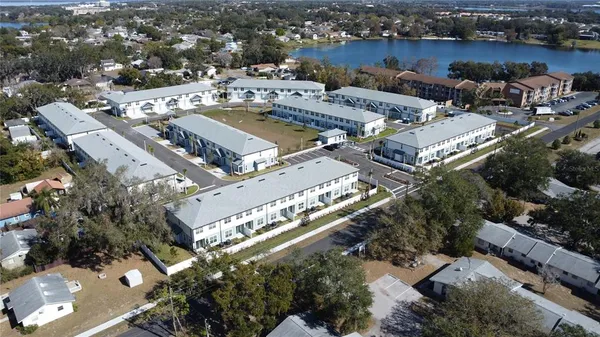an aerial view of a city with lake