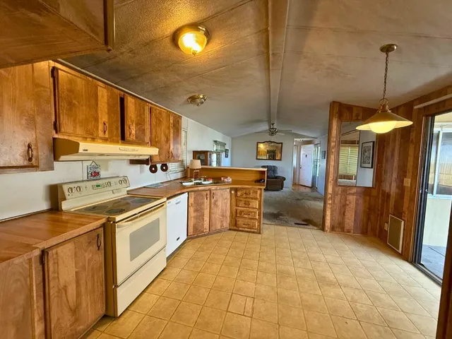 a kitchen with stainless steel appliances granite countertop a sink and cabinets