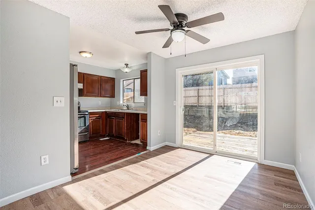 a kitchen with a sink stove and microwave