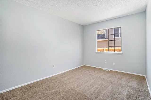 a bathroom with a sink toilet vanity and shower