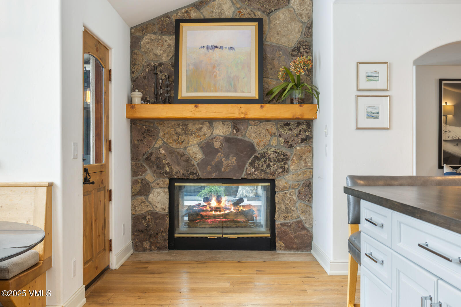 55 Elk Place Edwards, CO 81632 - Photo 13 of 68 a living room with fireplace and a wooden floor