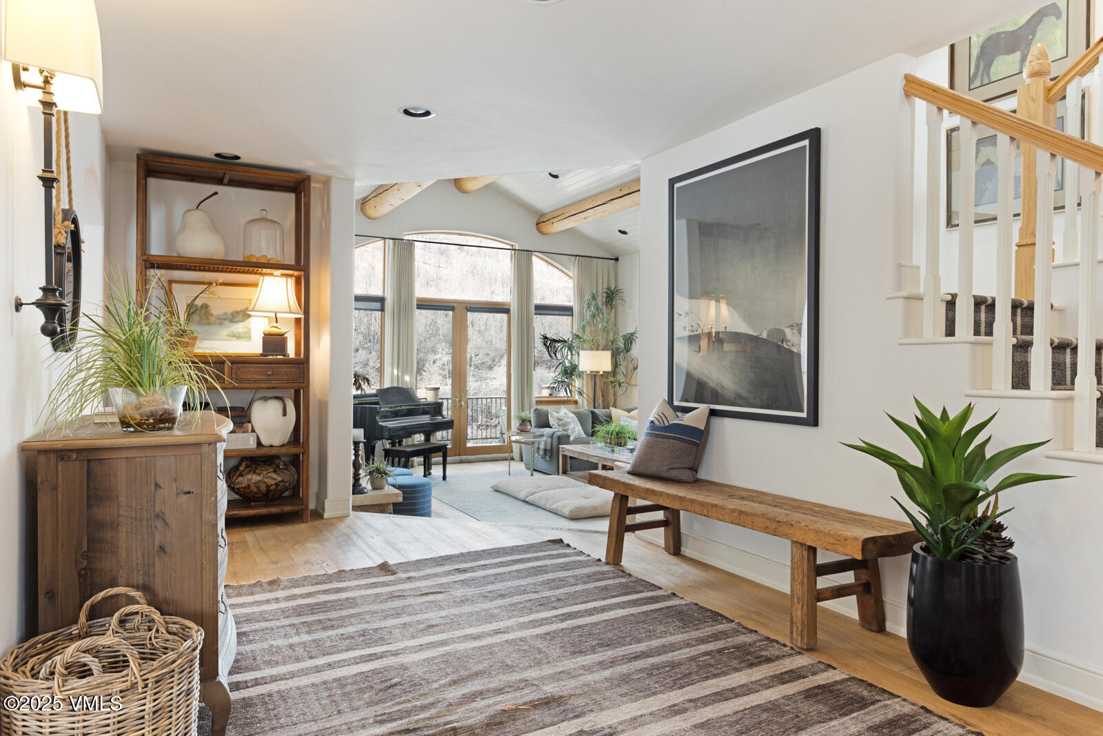 55 Elk Place Edwards, CO 81632 - Photo 18 of 68 a living room with furniture potted plant and a large window