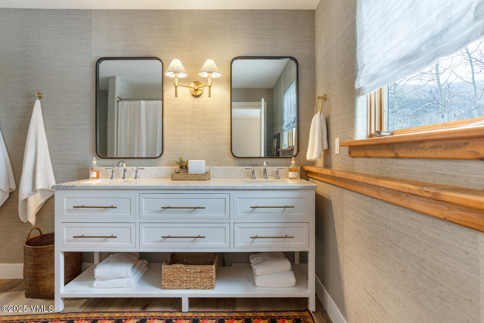 55 Elk Place Edwards, CO 81632 - Photo 42 of 68 a bathroom with a double vanity sink and a mirror