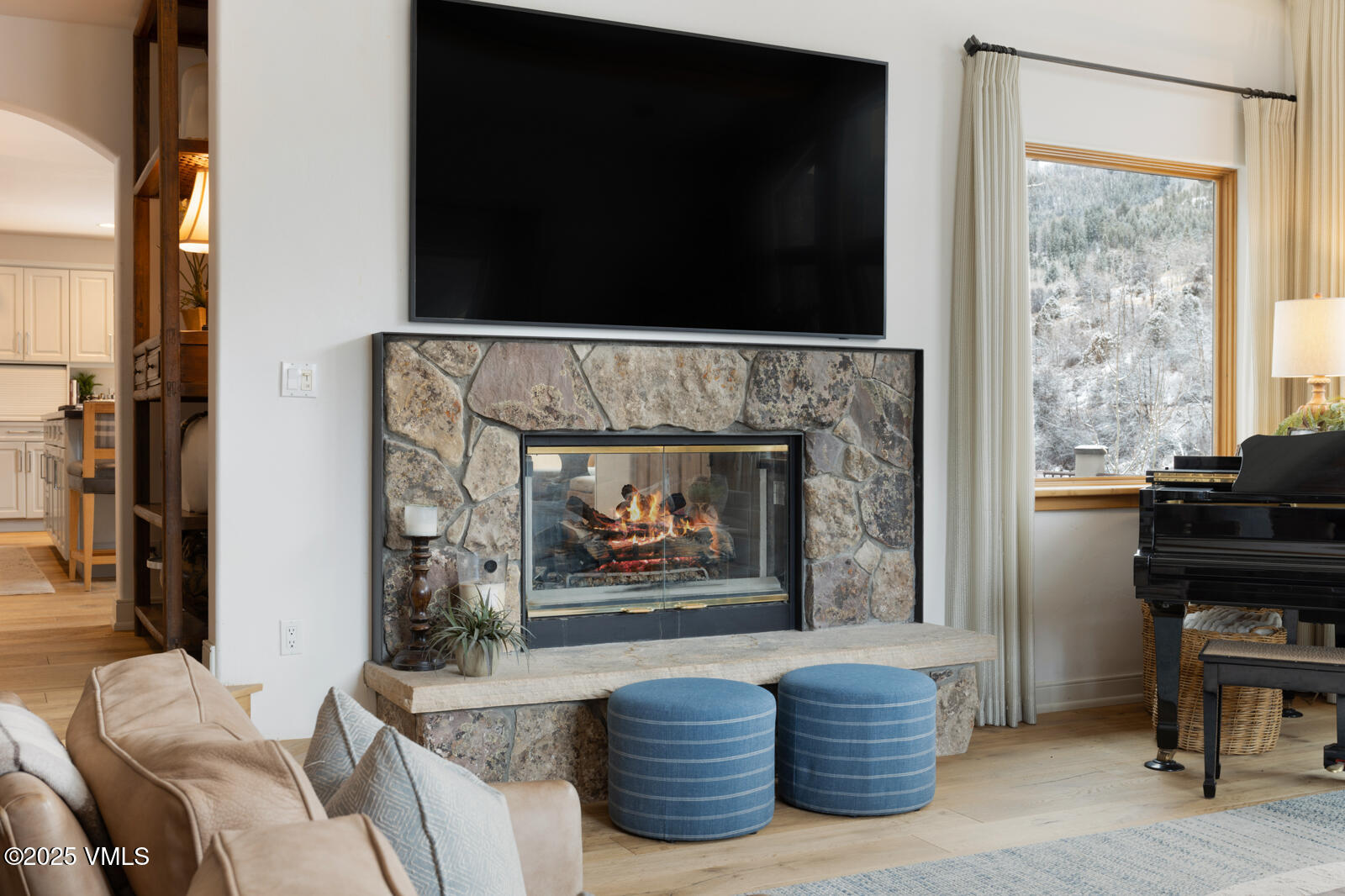 55 Elk Place Edwards, CO 81632 - Photo 5 of 68 a living room with furniture a fireplace and a flat screen tv