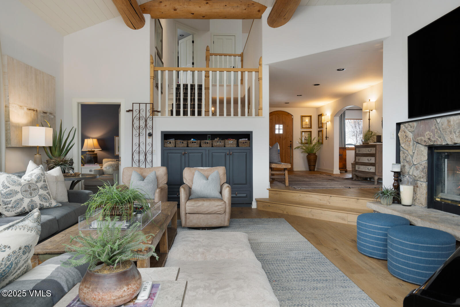 55 Elk Place Edwards, CO 81632 - Photo 6 of 68 a living room with furniture a fireplace and a flat screen tv
