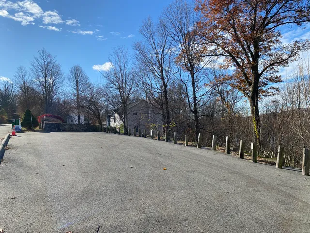 a view of a house with a tree in the background