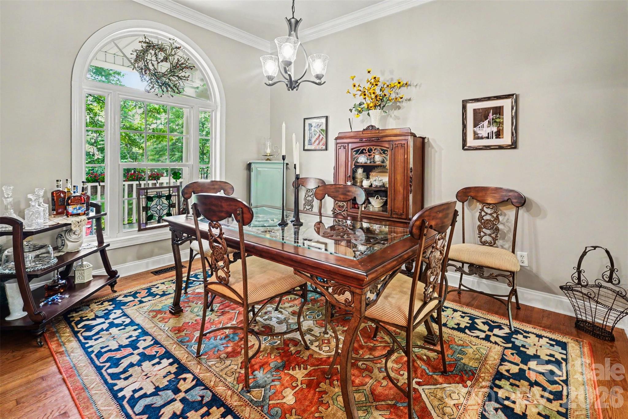 4037 Old Williamston Road Belton, SC 29627 - Photo 6 of 41 a view of a dining room with furniture a chandelier and wooden floor