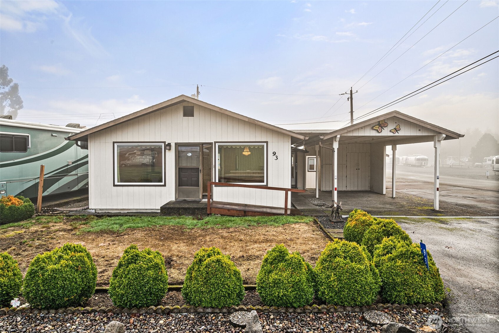 a front view of a house with garden