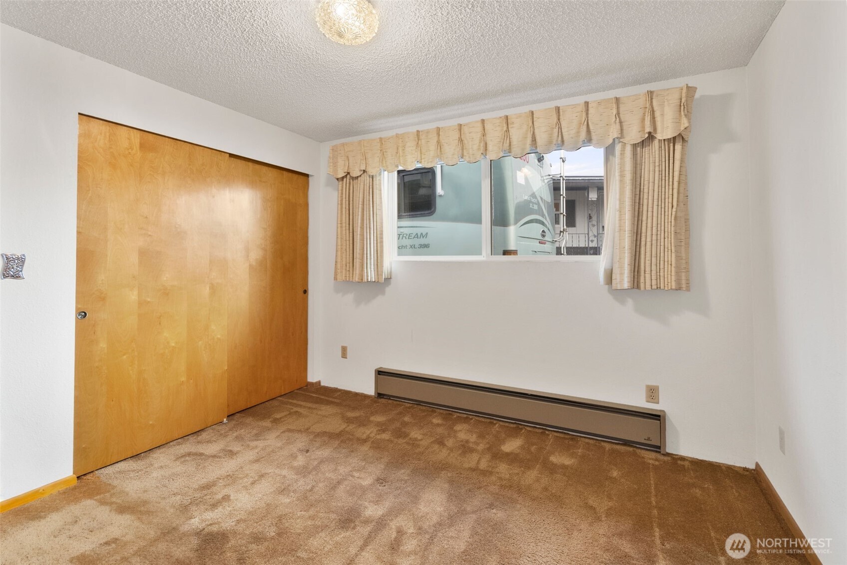 9101 Steilacoom Road Southeast, Unit 93 Olympia, WA 98513 - Photo 12 of 40 a view of an empty room with a window
