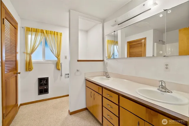 a bathroom with a sink a vanity and mirror