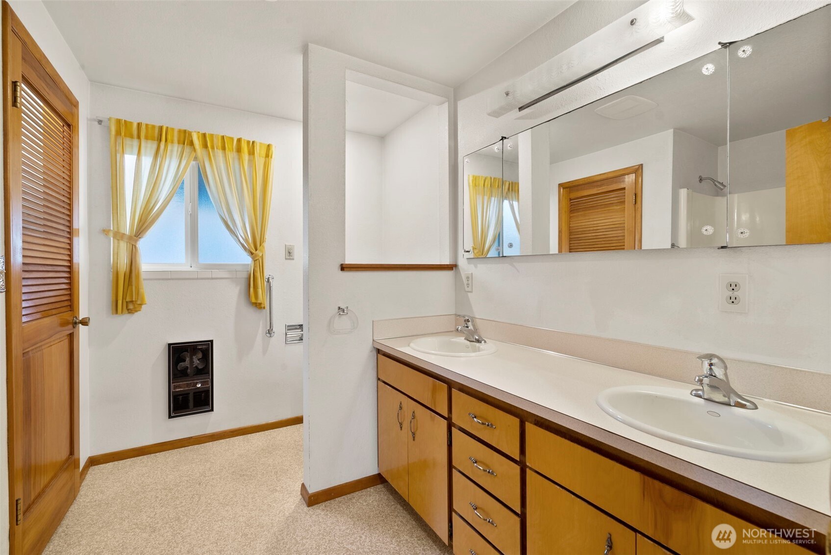 9101 Steilacoom Road Southeast, Unit 93 Olympia, WA 98513 - Photo 13 of 40 a bathroom with a sink a vanity and mirror