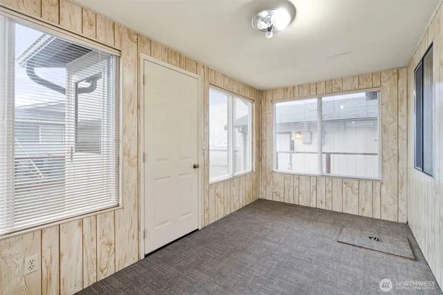 a view of an empty room with a window